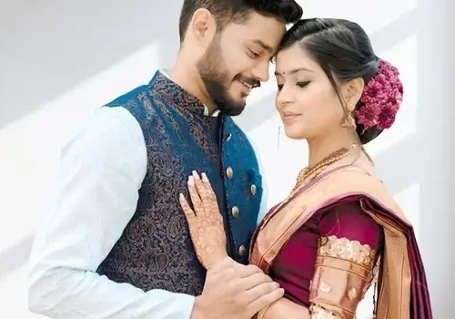 A couple in wedding outfits custom-made by CloudTailor